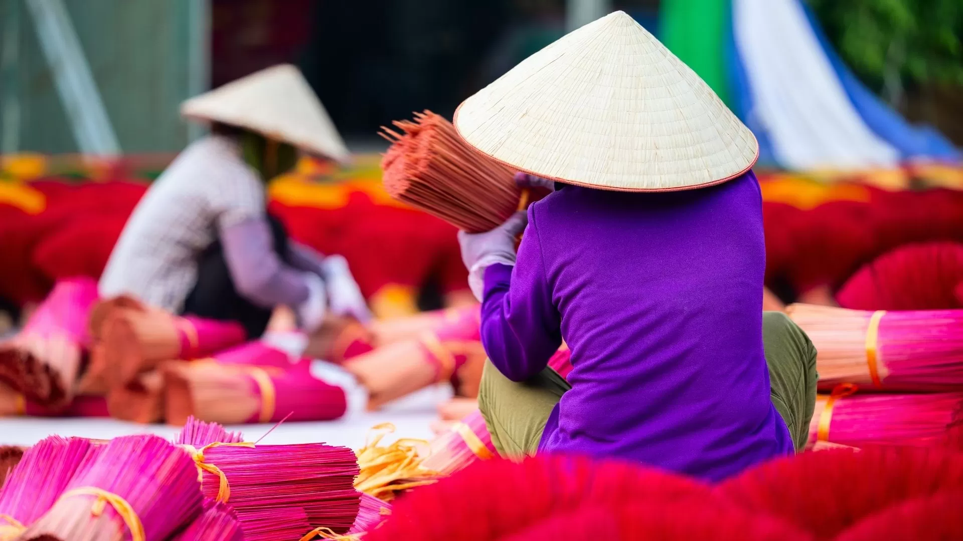 Artisan making incense sticks in Quang Phu Cau village.